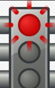 Traffic signal head with the top red lamp flashing and the amber and green lamps dark